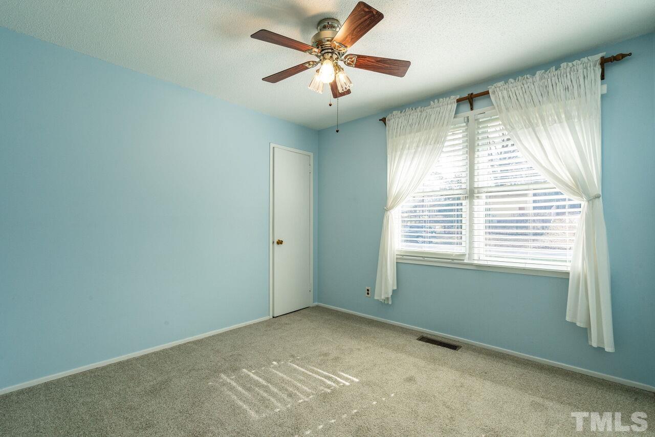 211 Quail Drive Raleigh, NC 27604 - Photo 18 of 28 a view of an empty room with a window