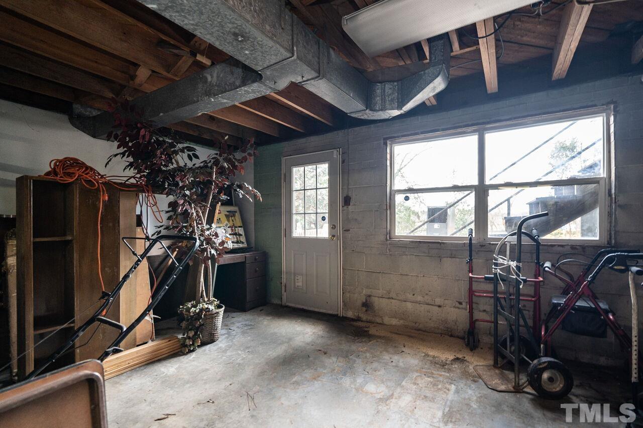 211 Quail Drive Raleigh, NC 27604 - Photo 25 of 28 a view of a room with gym equipment