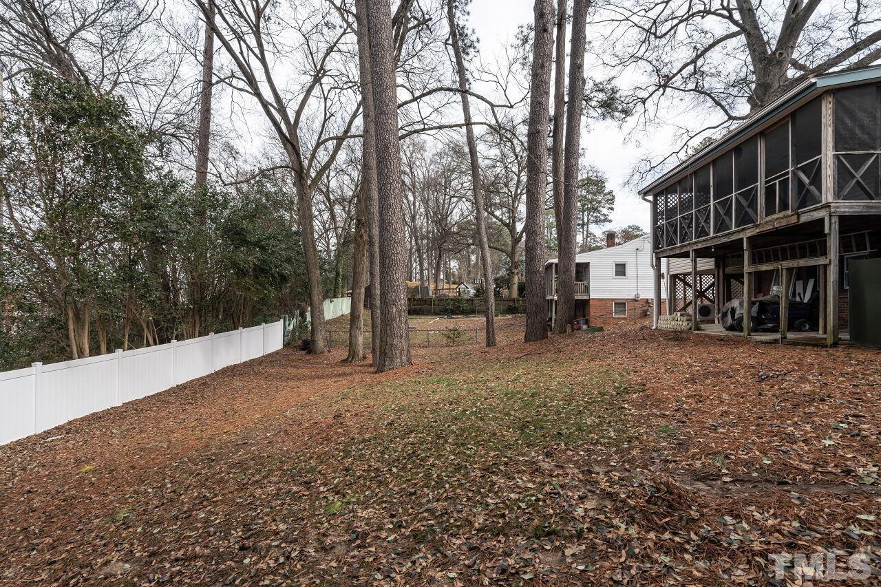 211 Quail Drive Raleigh, NC 27604 - Photo 27 of 28 a view of road with large trees