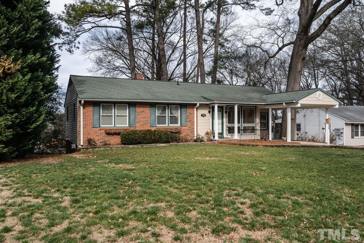 211 Quail Drive Raleigh, NC 27604 - Photo 3 of 28 a front view of a house with a garden