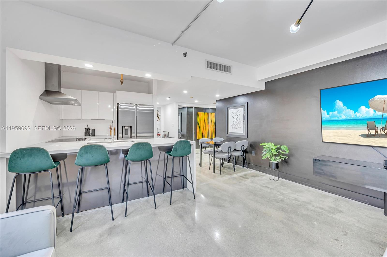 540 Brickell Key Drive, Unit 409 Miami, FL 33131 - Photo 6 of 20 a view of a dining room with furniture and chandelier