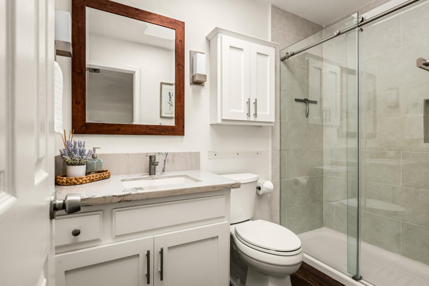 10875 Spenceville Road Penn Valley, CA 95946 - Photo 20 of 49 a bathroom with a sink toilet vanity and shower