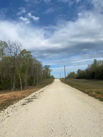a view of a backyard of a house