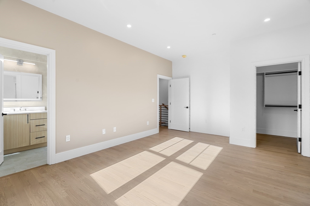 143 Tremont Street, Unit A Boston, MA 02135 - Photo 13 of 28 a view of an empty room with a kitchen