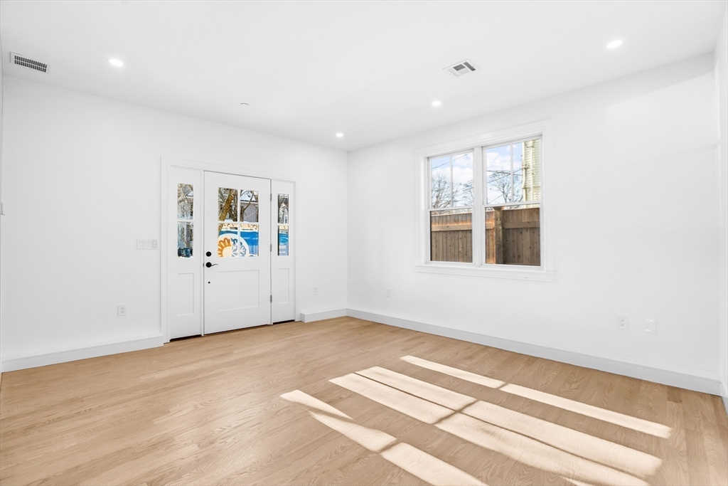 143 Tremont Street, Unit A Boston, MA 02135 - Photo 21 of 28 a view of empty room with window