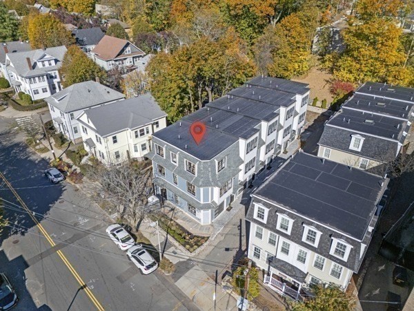 143 Tremont Street, Unit A Boston, MA 02135 - Photo 25 of 28 an aerial view of residential houses with outdoor space