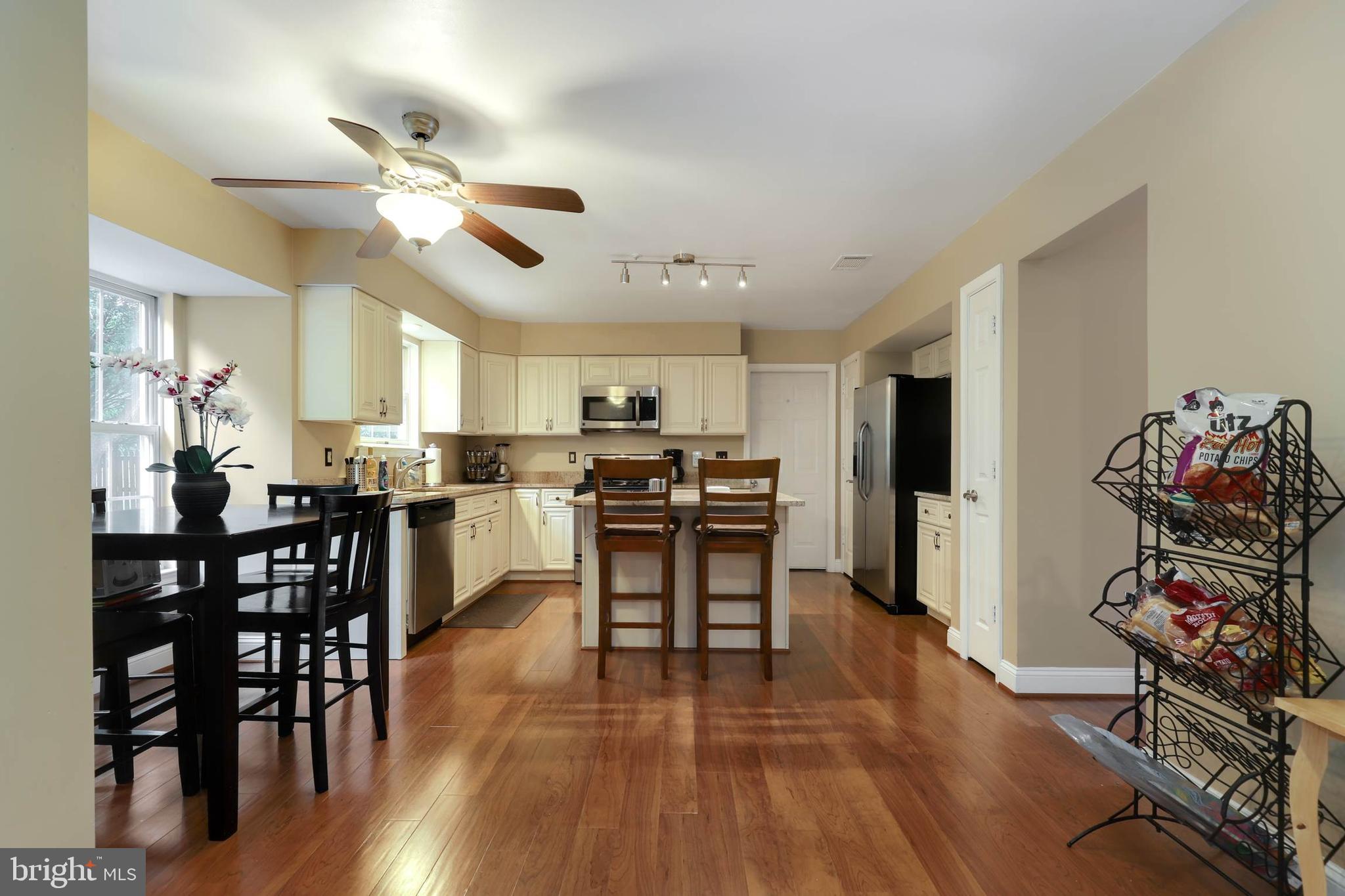 9211 Sandy Creek Road Fort Washington, MD 20744 - Photo 11 of 30 a view of a dining room with furniture and wooden floor
