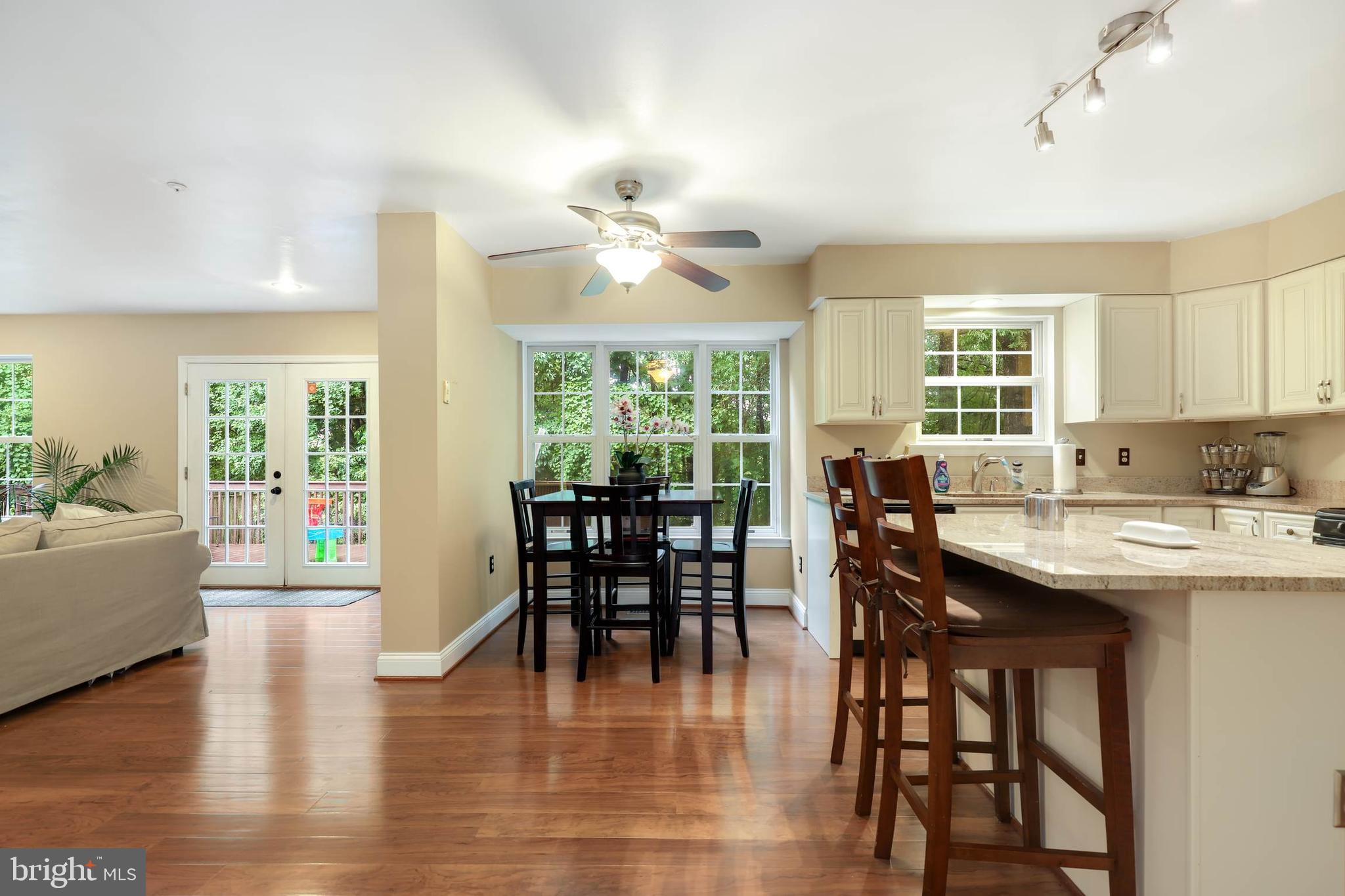 9211 Sandy Creek Road Fort Washington, MD 20744 - Photo 13 of 30 a view of a a dining room with furniture window and wooden floor