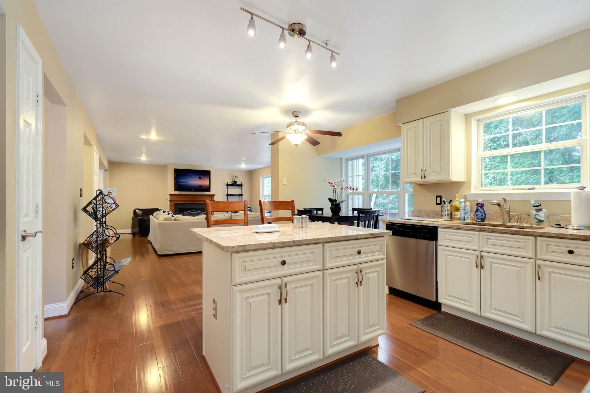 9211 Sandy Creek Road Fort Washington, MD 20744 - Photo 18 of 30 a large white kitchen with cabinets a sink and appliances
