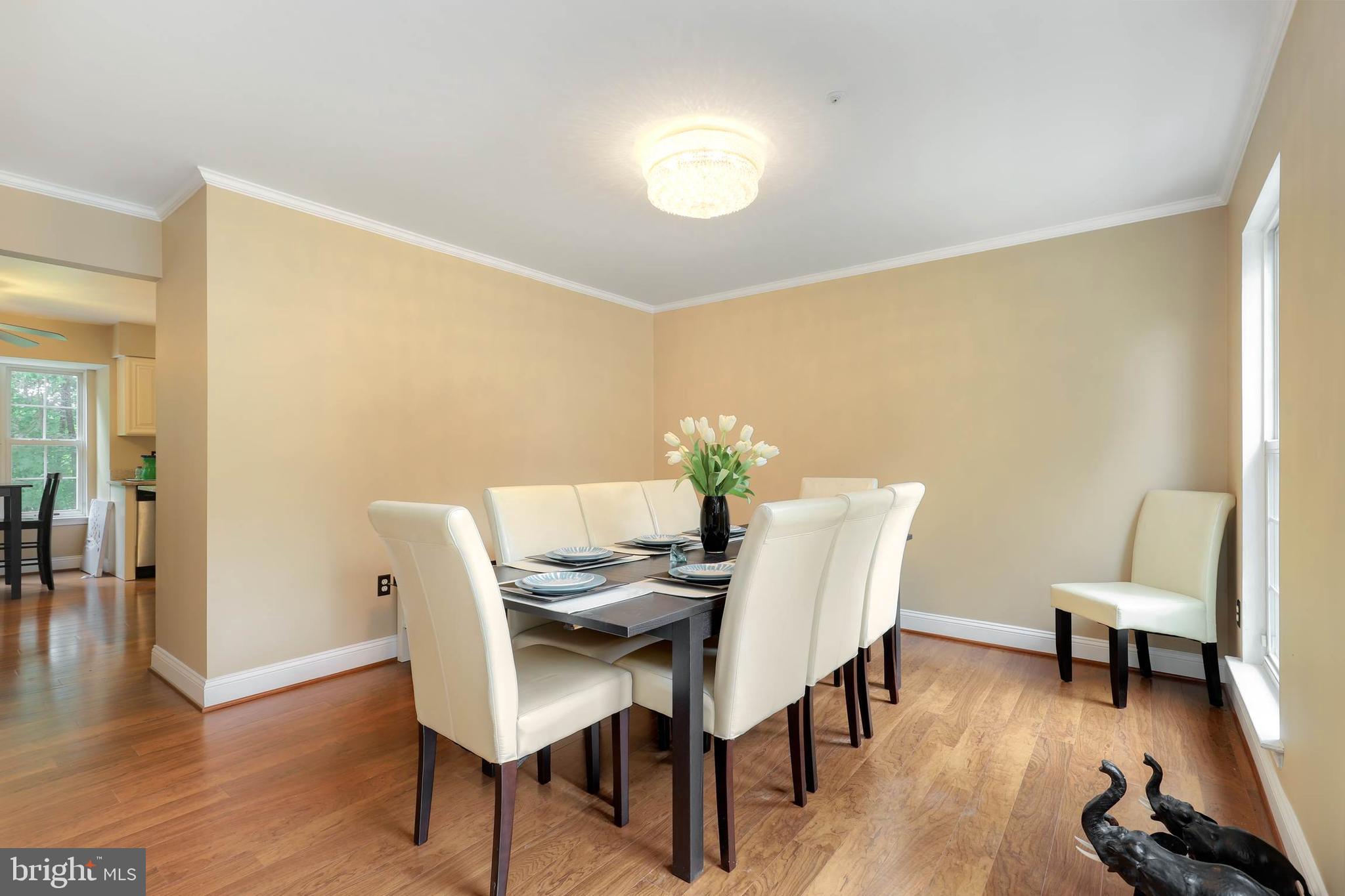 9211 Sandy Creek Road Fort Washington, MD 20744 - Photo 19 of 30 a view of a dining room with furniture and wooden floor