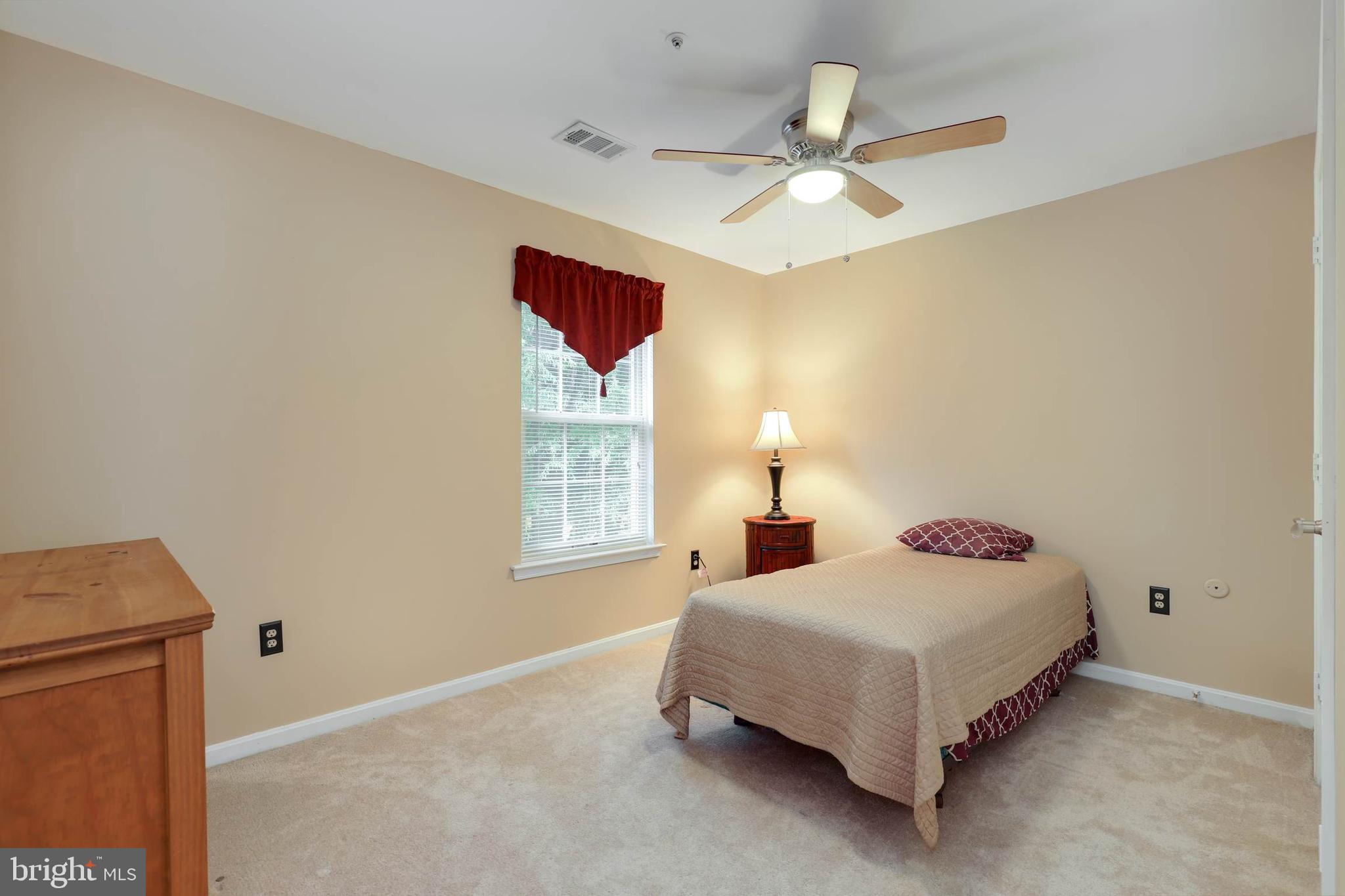 9211 Sandy Creek Road Fort Washington, MD 20744 - Photo 26 of 30 a bedroom with a bed and window