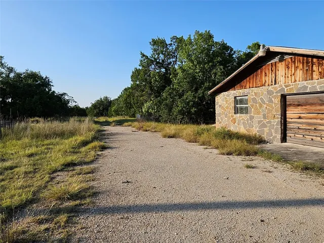 a view of a yard with an outdoor space