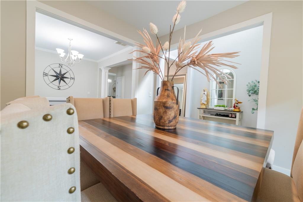 1567 Maplecliff Way Sugar Hill, GA 30518 - Photo 11 of 31 a view of living room with furniture and a chandelier