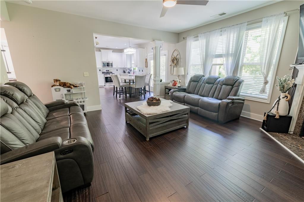 1567 Maplecliff Way Sugar Hill, GA 30518 - Photo 17 of 31 a living room with furniture and a flat screen tv