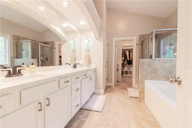 a bathroom with a sink a mirror and a vanity