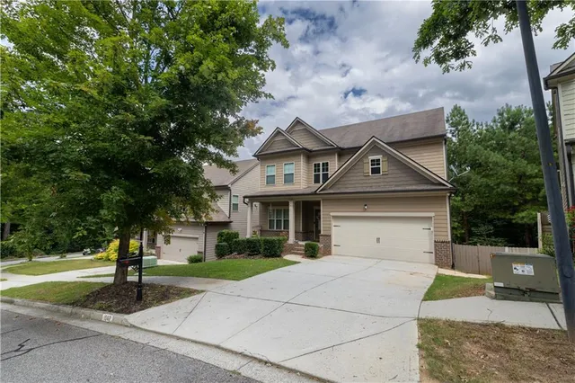 a front view of a house with a yard