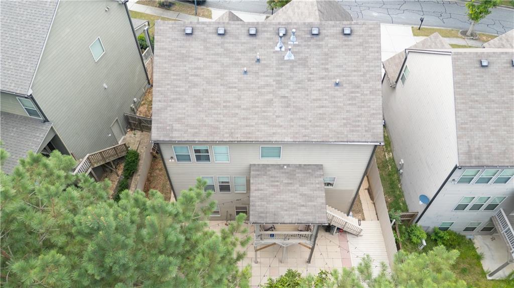 1567 Maplecliff Way Sugar Hill, GA 30518 - Photo 28 of 31 an aerial view of a house with chairs