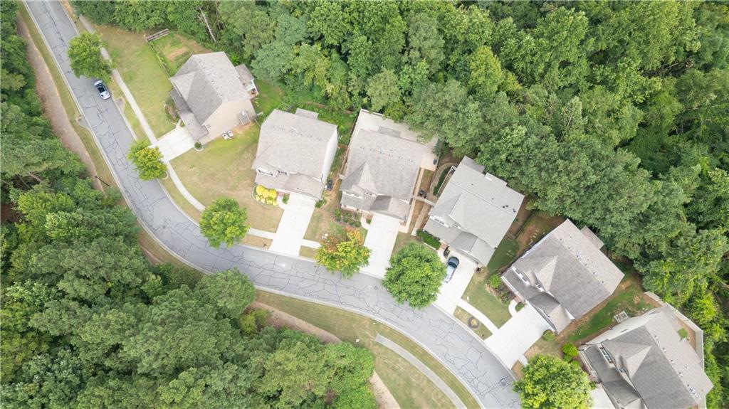 1567 Maplecliff Way Sugar Hill, GA 30518 - Photo 29 of 31 an aerial view of a house with outdoor space and a lake view