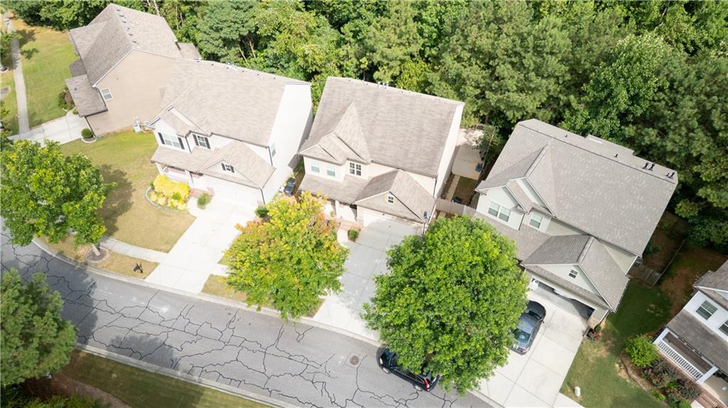 1567 Maplecliff Way Sugar Hill, GA 30518 - Photo 30 of 31 an aerial view of residential house with outdoor space and swimming pool
