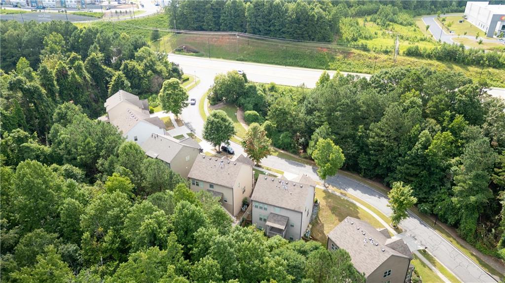 1567 Maplecliff Way Sugar Hill, GA 30518 - Photo 31 of 31 an aerial view of a house with a yard and lake view