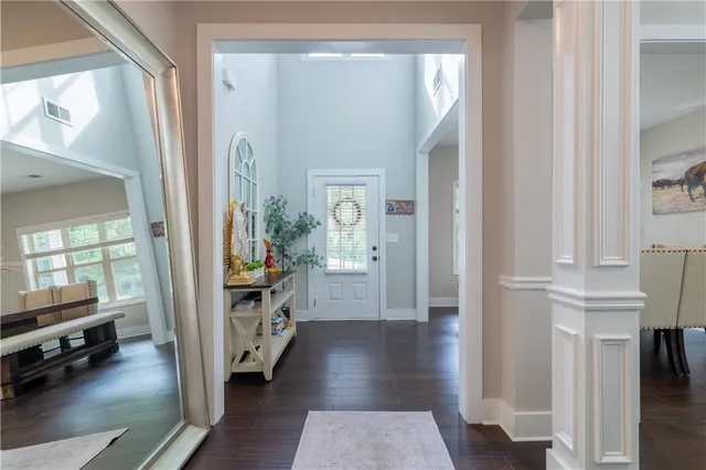 a view of a hallway view with wooden floor and furniture