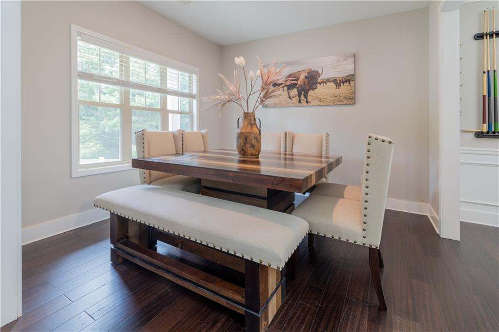 1567 Maplecliff Way Sugar Hill, GA 30518 - Photo 10 of 31 a living room with furniture and wooden floor