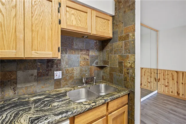 a bathroom with granite countertop a sink and a granite top
