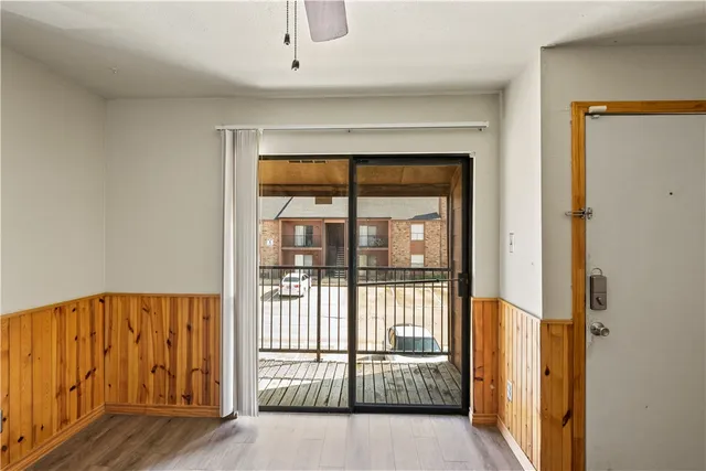 a front view of a house with a yard and a garage