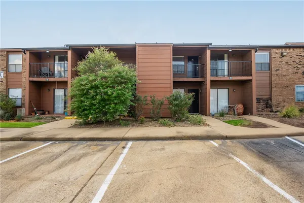 a front view of building with yard