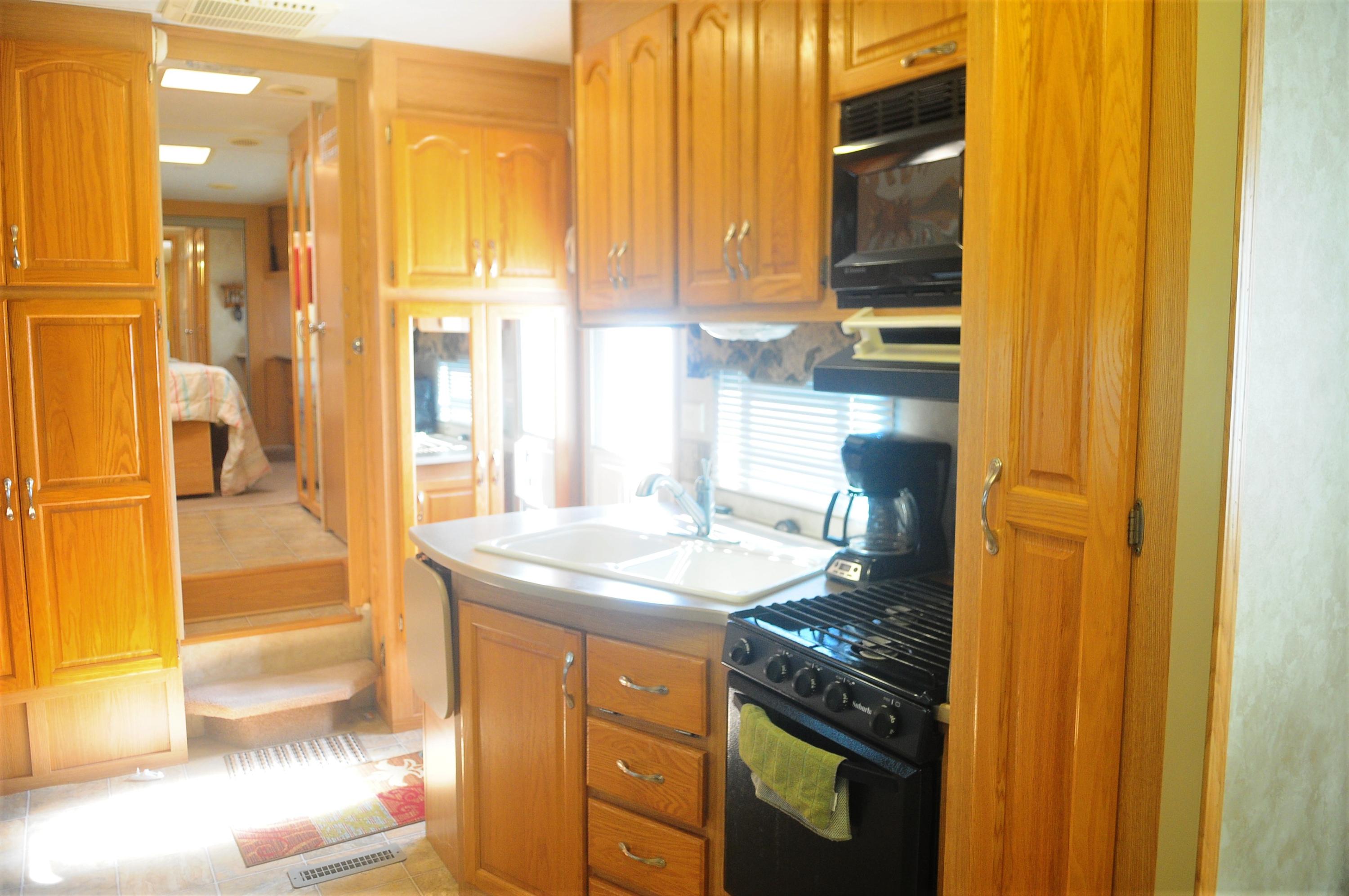 55 Boca Chica Road, Unit 461 Key West, FL 33040 - Photo 11 of 37 a bathroom with a granite countertop sink and a mirror
