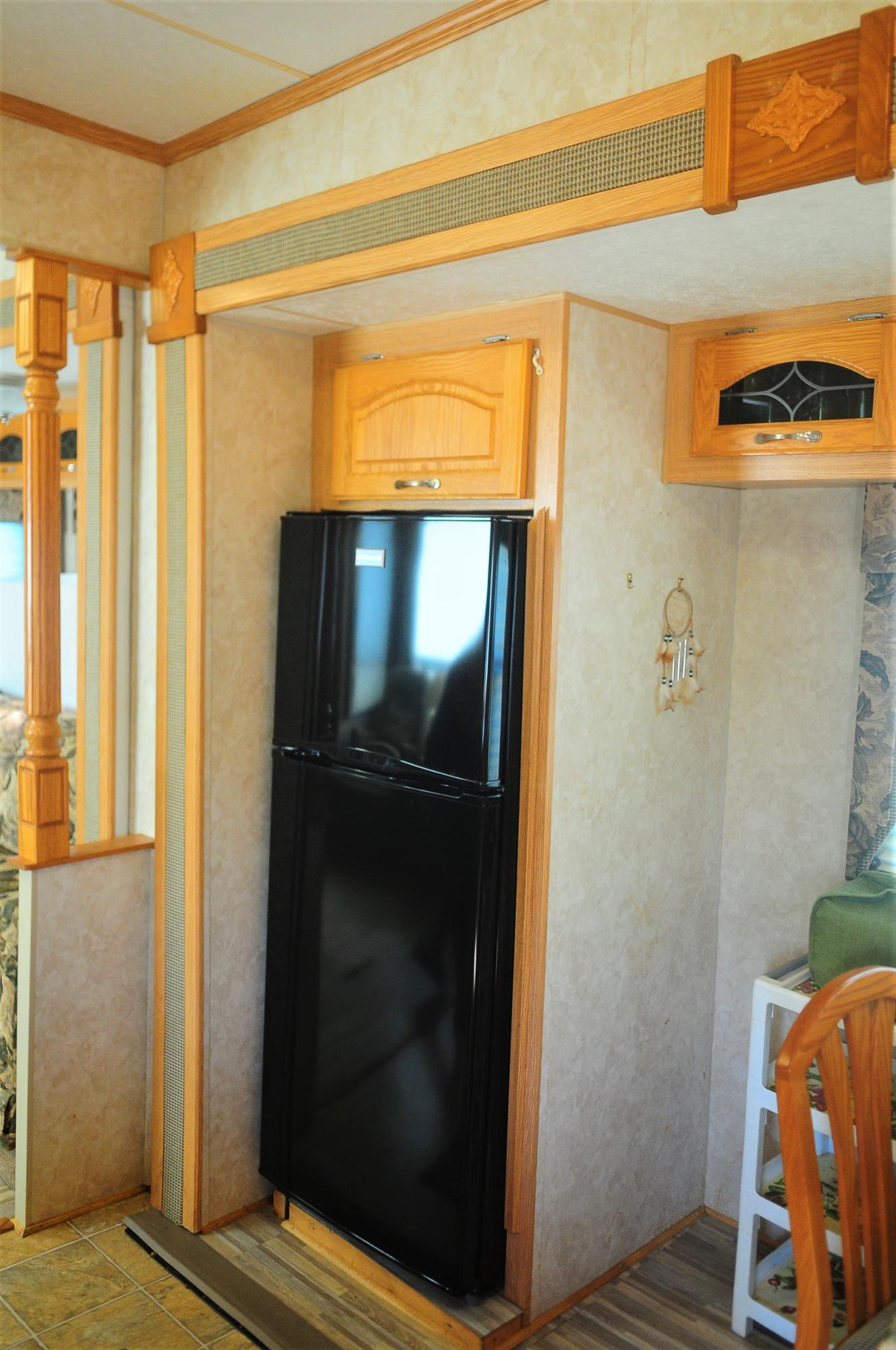 55 Boca Chica Road, Unit 461 Key West, FL 33040 - Photo 14 of 37 a bathroom with a walk in closet and wooden floor