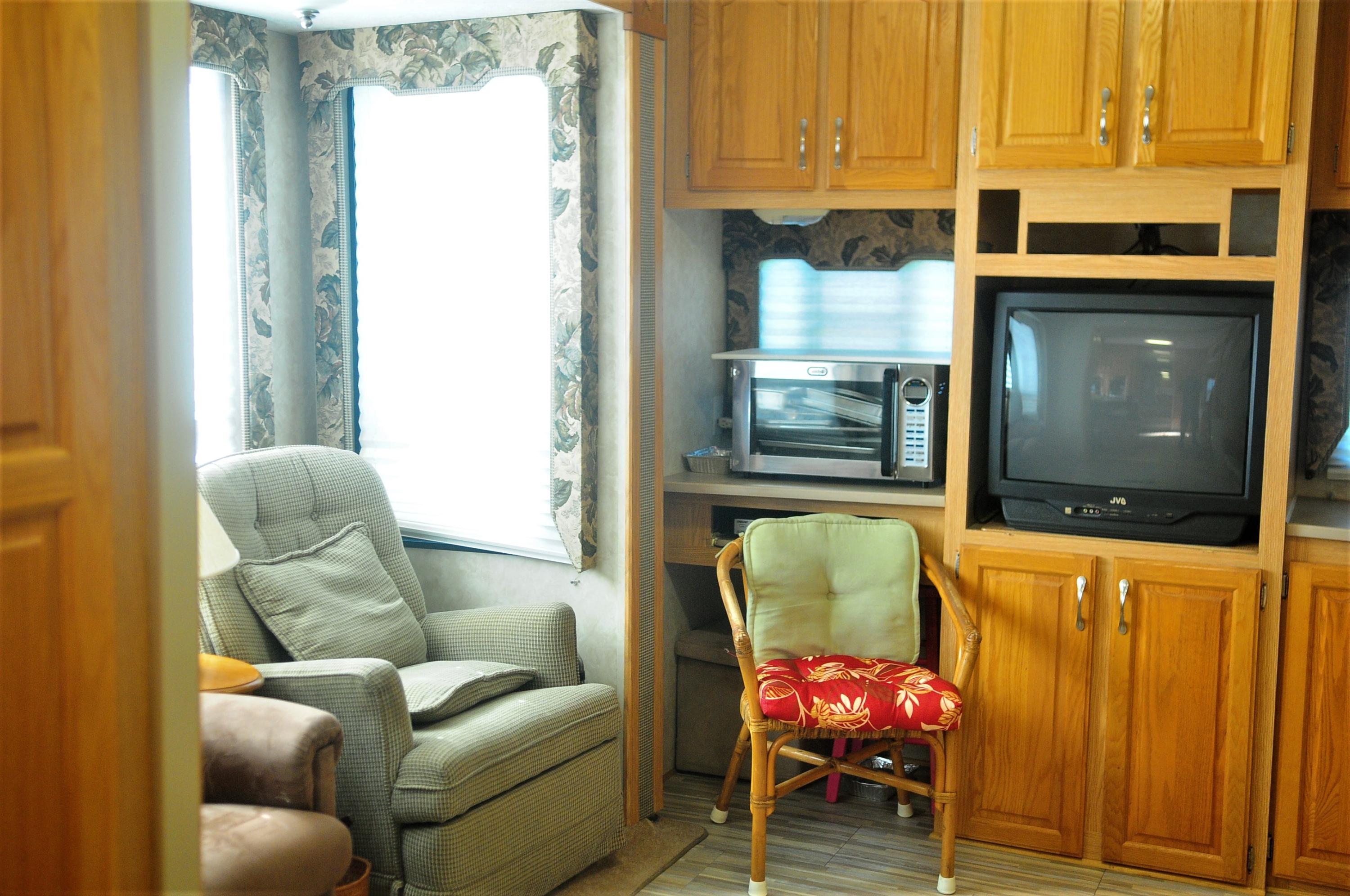 55 Boca Chica Road, Unit 461 Key West, FL 33040 - Photo 17 of 37 a living room with furniture and a window