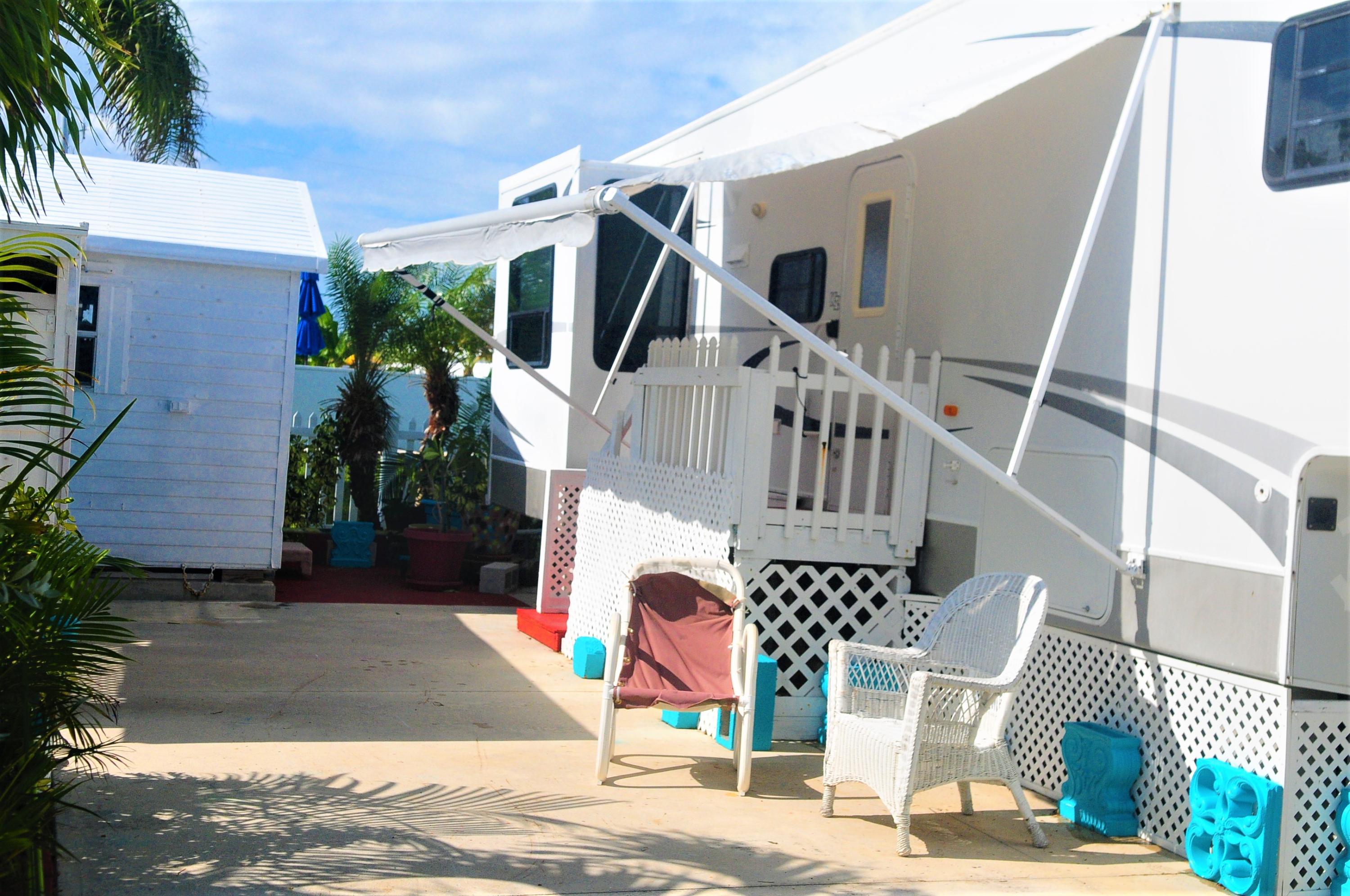 55 Boca Chica Road, Unit 461 Key West, FL 33040 - Photo 2 of 37 a front view of a house with garden
