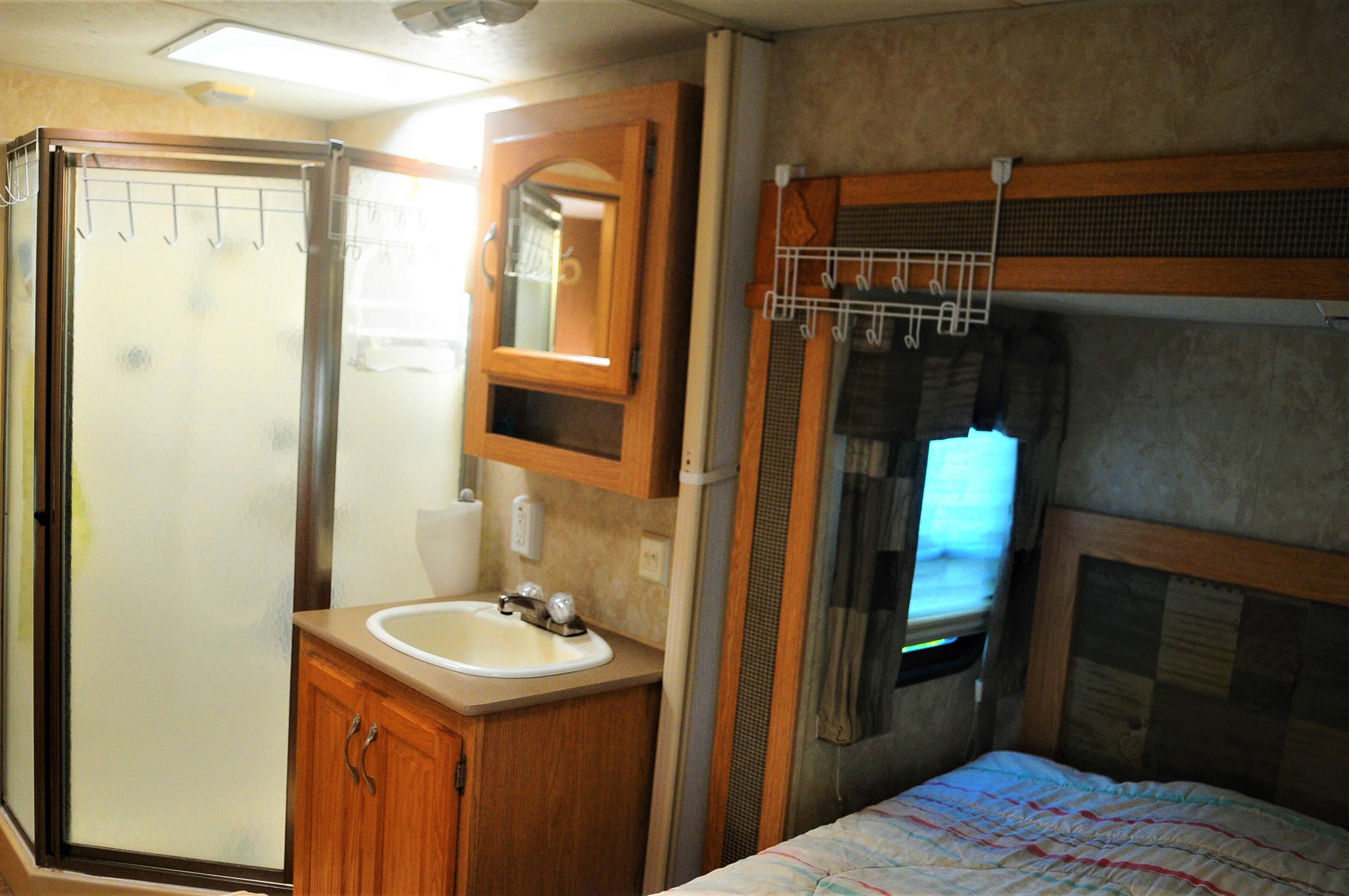 55 Boca Chica Road, Unit 461 Key West, FL 33040 - Photo 22 of 37 a bathroom with a sink a toilet and shower