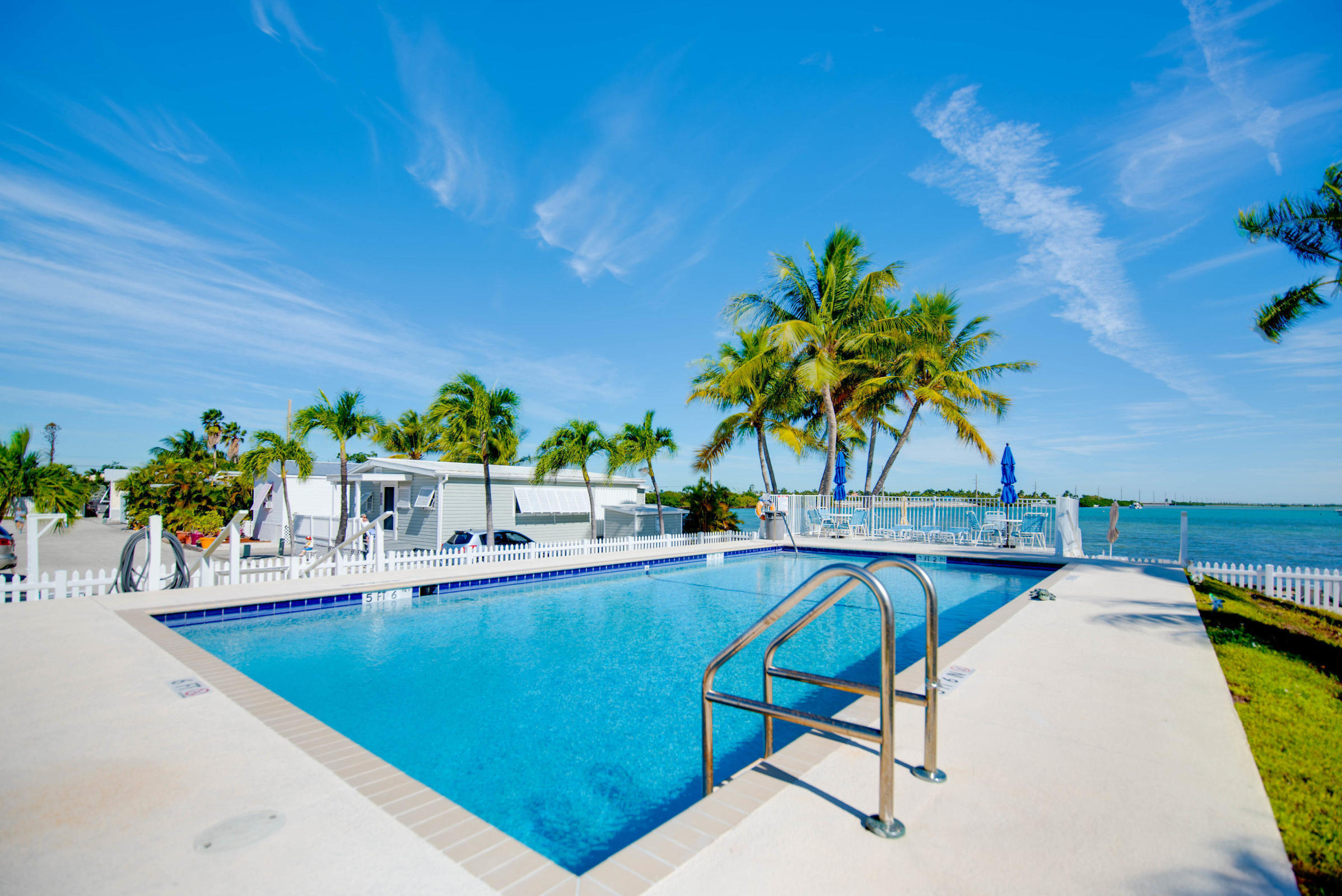 55 Boca Chica Road, Unit 461 Key West, FL 33040 - Photo 29 of 37 a view of a swimming pool with chairs