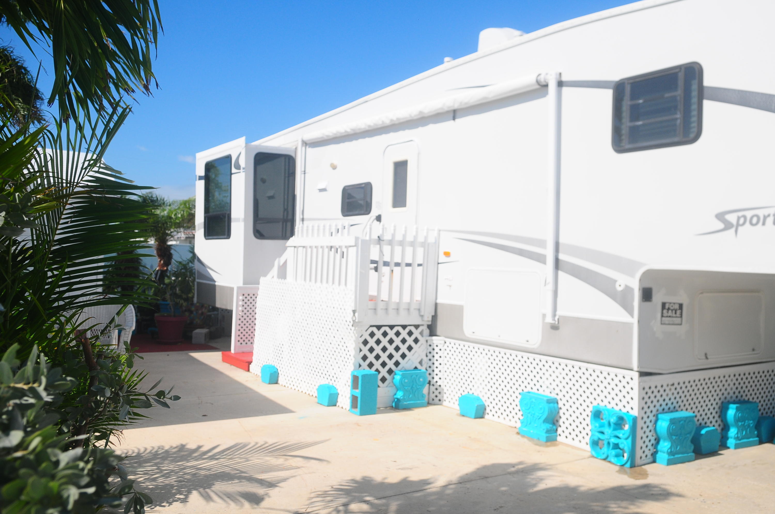 55 Boca Chica Road, Unit 461 Key West, FL 33040 - Photo 7 of 37 a white building with a tree in front of it