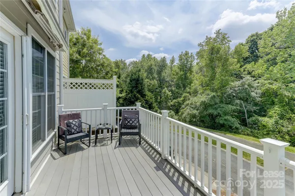 a view of balcony with furniture