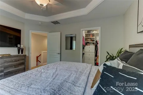 a bedroom with a bed and furniture