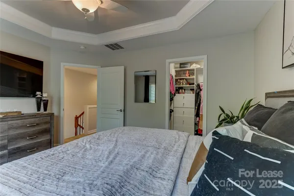 a bedroom with a bed and furniture