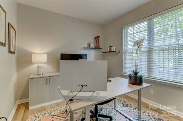 a view of a workspace with furniture