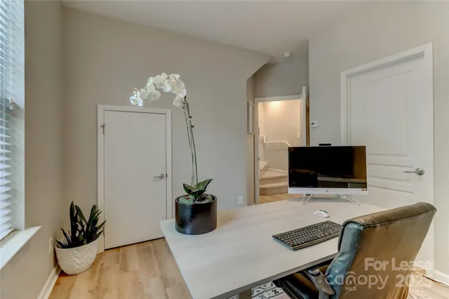 a view of a livingroom with furniture and wooden floor
