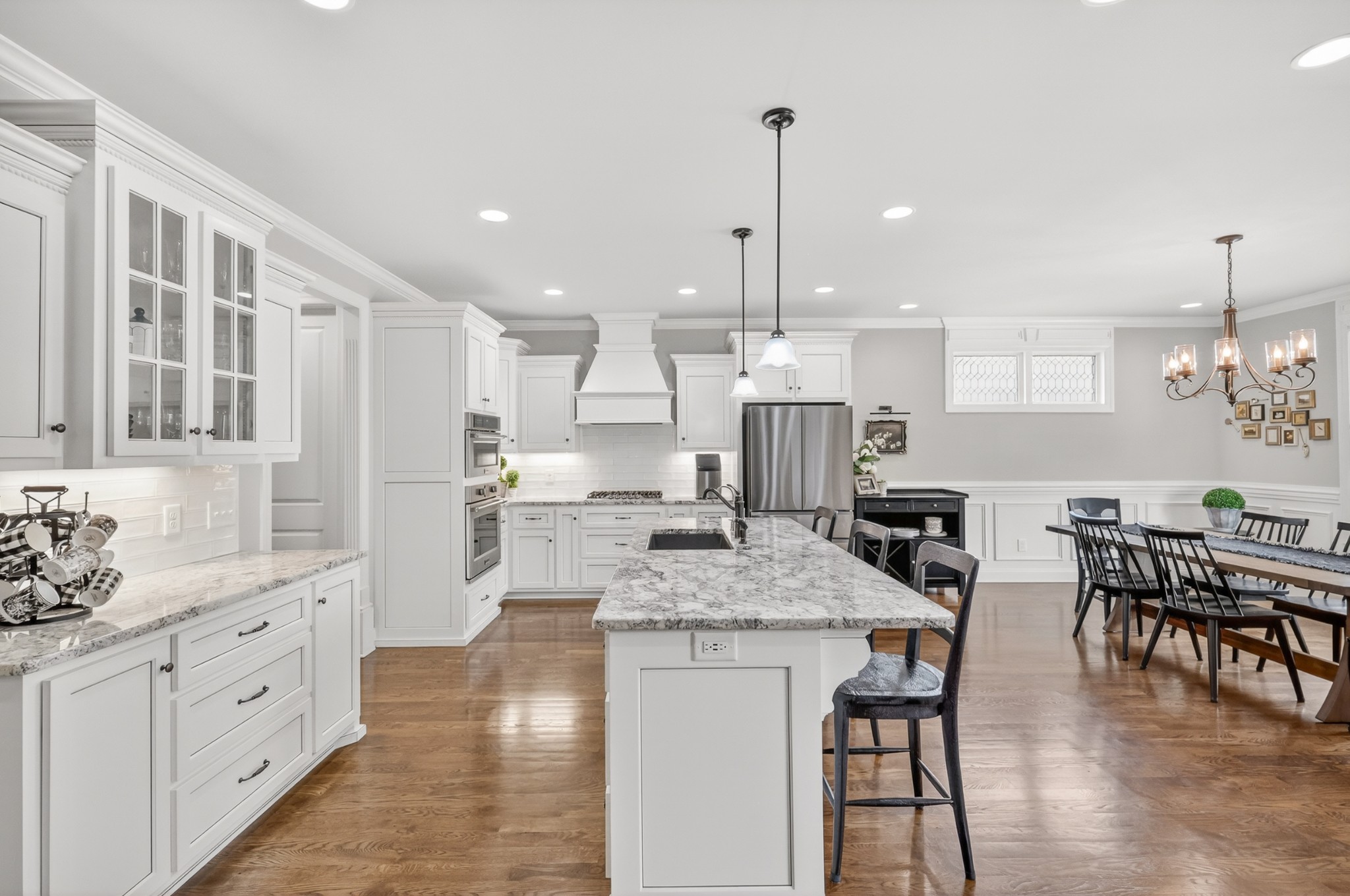 2007 Imagine Circle Spring Hill, TN 37174 - Photo 15 of 44 a kitchen with stainless steel appliances kitchen island granite countertop a kitchen island a stove a table and chairs