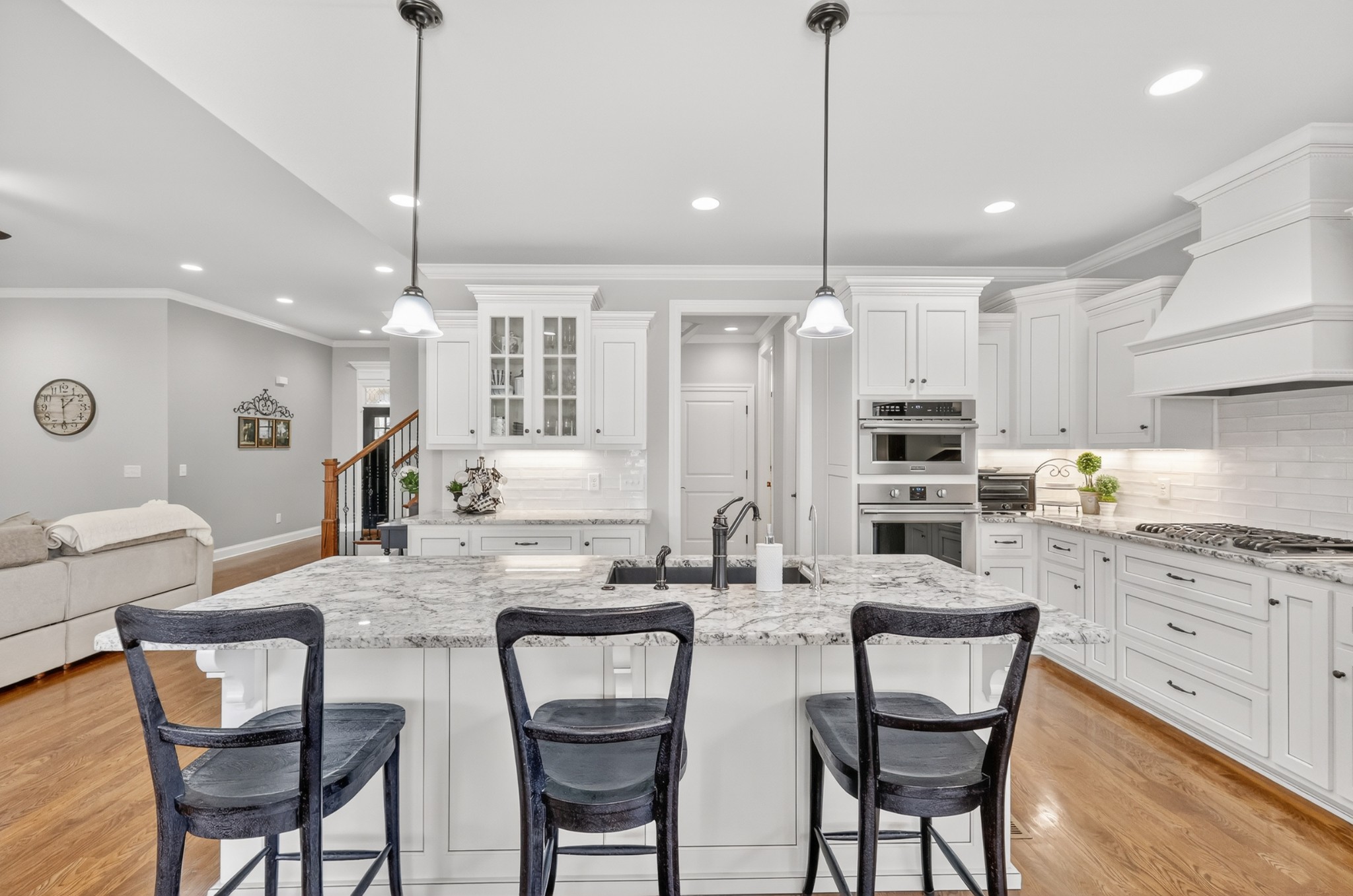 2007 Imagine Circle Spring Hill, TN 37174 - Photo 20 of 44 a kitchen with stainless steel appliances kitchen island granite countertop a dining table chairs and white cabinets