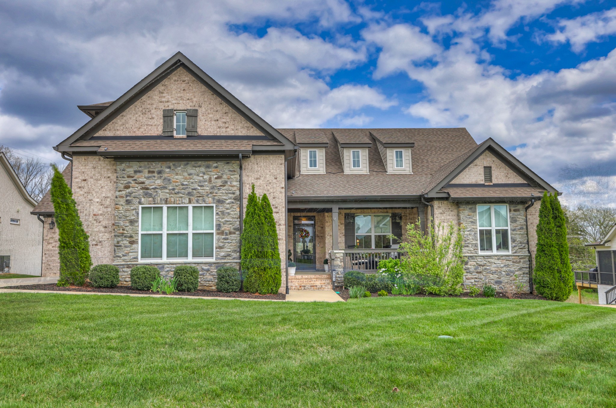 2007 Imagine Circle Spring Hill, TN 37174 - Photo 2 of 44 a front view of a house with a garden