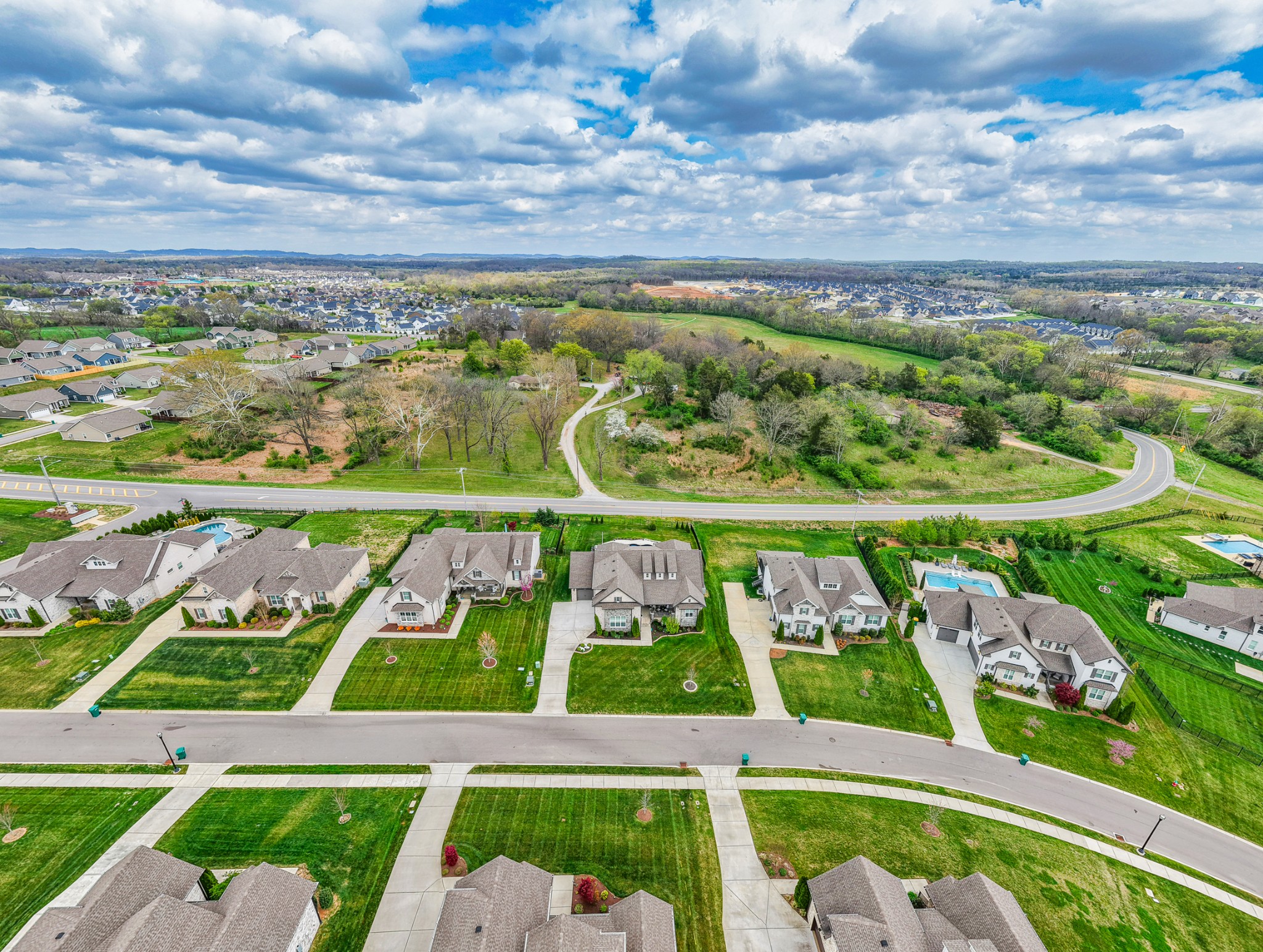 2007 Imagine Circle Spring Hill, TN 37174 - Photo 3 of 44 a view of an swimming pool with a yard