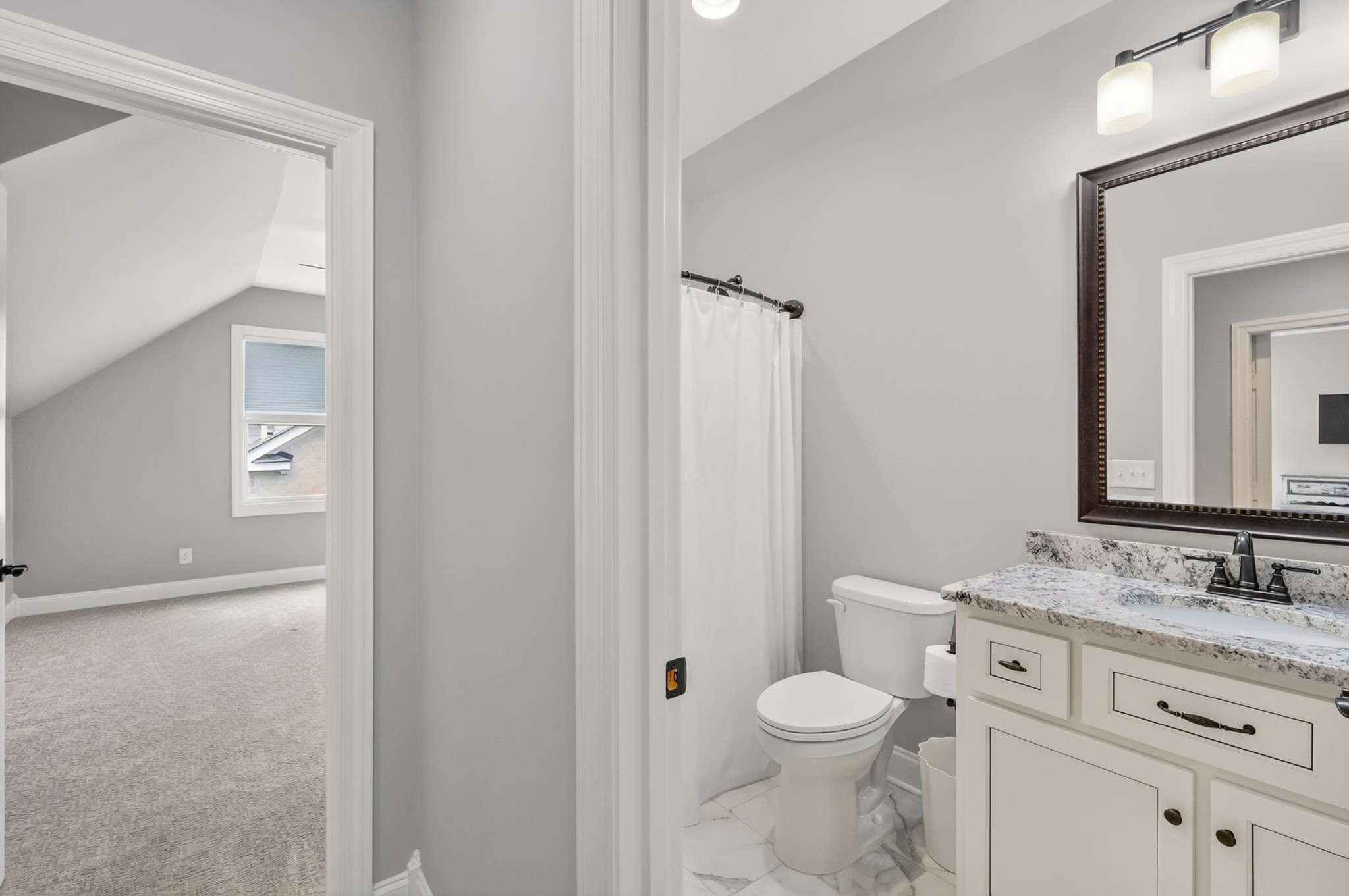 2007 Imagine Circle Spring Hill, TN 37174 - Photo 39 of 44 a bathroom with a granite countertop toilet a sink and a mirror