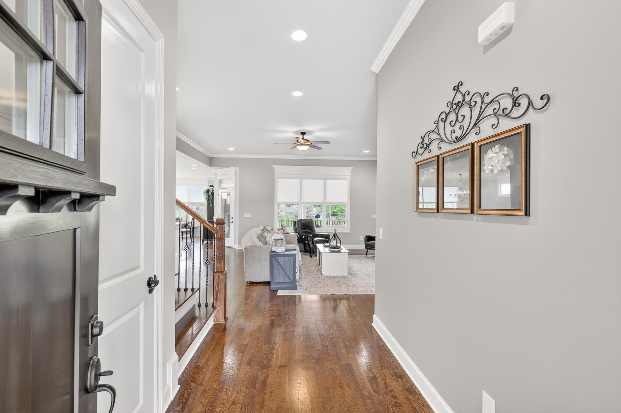 2007 Imagine Circle Spring Hill, TN 37174 - Photo 10 of 44 a view of a hallway with wooden floor and a living room