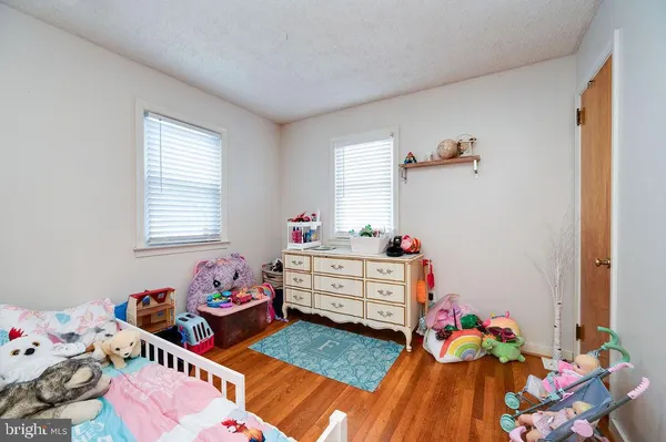 a kids room with toys and a window