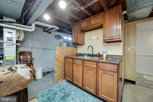 a patio with wooden table and chairs