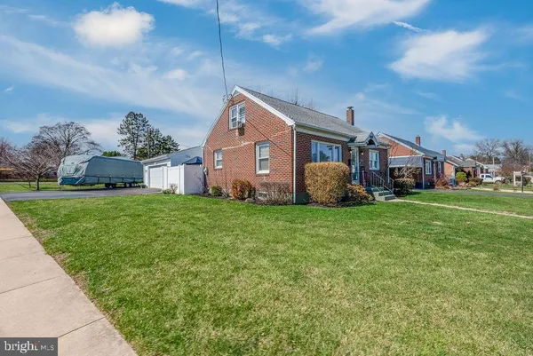 a front view of house with garden